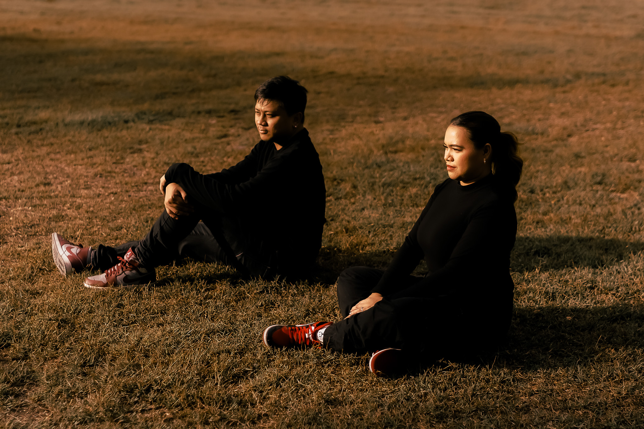 Couple sitting in autumn field